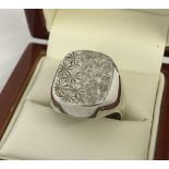 A Gents silver signet ring.