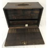 A vintage wooden engineers tool cabinet with 7 internal drawers.