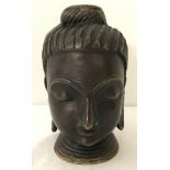 A bronze head of a Buddhist deity.