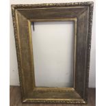 A large heavy 19th Century gilt frame.