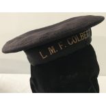 A French naval cap with L.M.F. Colbert tally band.