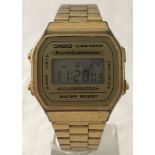 A vintage Casio gold tone digital wrist watch in working order.