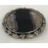 Large oval Blue John crystal brooch in ornate silver mount.