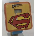 A Superman DC Comics / McDonalds digital wristwatch with paper face.