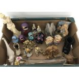 A box of assorted ceramics and ornaments.