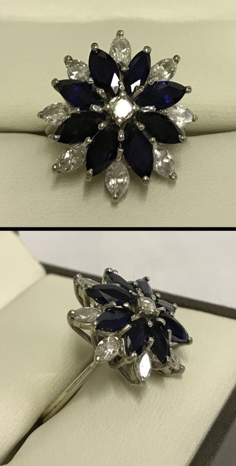 An 18ct white gold sapphire & diamond cluster ring.