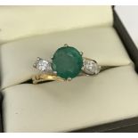 An 18ct yellow gold, prong set, 3 stone emerald and diamond dress ring.
