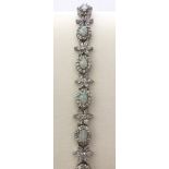 An Opal, & white stone bracelet, set in 925 silver. Cased.