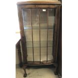 Vintage oak display cabinet with glazed front and sides.