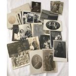 A small collection of vintage photographs and photographic postcards.