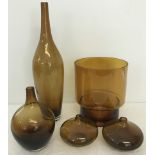 A collection of 5 amber coloured glass vases.