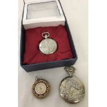 2 modern quartz hunter pocket watches with decorative cases.