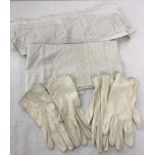 A small collection of vintage embroidery and lace fabric together with 2 pairs of white kid gloves.