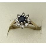 A 18ct gold yellow gold sapphire and diamond dress ring.