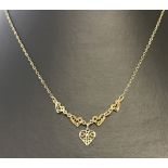 A 9ct gold fine chain necklace with 4 small filigree hearts and a larger filigree heart drop.