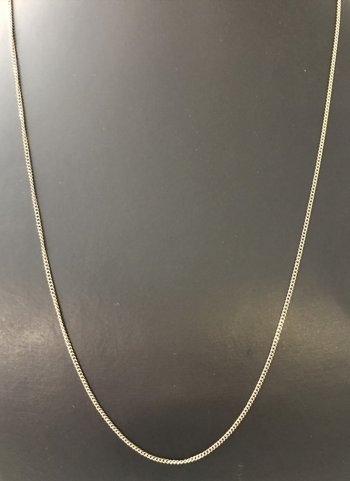 A 22inch 9ct gold fine curb chain.