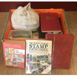A box of 8 vintage stamp albums, 2 stamp catalogues, first day covers and a bag of loose stamps.