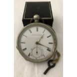 A vintage American Watch Co pocket watch with key.