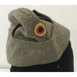 Post WWII German overseas side cap in green felt.