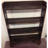 A dark oak open backed 4 shelf bookcase.