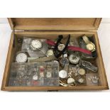 A box of watches for repairs, watch parts and straps.