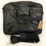 A black leather Jaeger laptop bag with 3 zipped compartments.