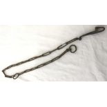 An unusual length of chain with end ring and fixing. Metal detector find.