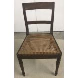 A cane seated hall chair.