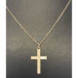 A 9ct gold cross on chain with engine turned decoration.