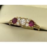 An 18ct yellow gold ruby and diamond ring.