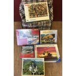 A collection of 12 boxed jigsaw puzzles to include 5 by Ravensburger, Waddington's and King.