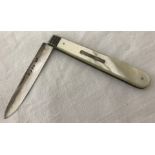 A Victorian silver blade fruit knife with mother of pearl handle and ridge detail.