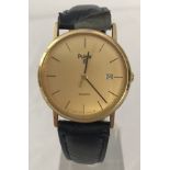 A gold coloured quartz wristwatch by Pulsar with blue leather strap.