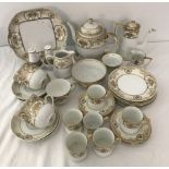 A collection of Noritake tea and coffee ware in white and gold pattern #44318.