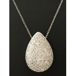 A 9ct white gold teardrop pendant set with 100+ small sparkling diamonds.