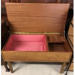 A vintage teak sewing/work box with lift up lid.