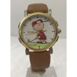 A Peanuts Armitron Quartz watch depicting Charlie Brown playing golf with original strap.