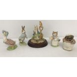 4 Royal Albert Beatrix Potter figurines together with an F.Warne & Co mounted resin figurine.