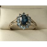 A 9ct gold blue tourmaline and blue topaz dress ring.