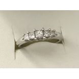 An 18ct white gold 5 stone princess cut diamond eternity ring.