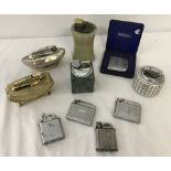 A collection of assorted vintage pocket and table lighters.