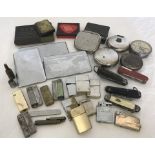 A quantity of vintage lighters and penknives.