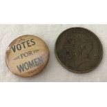 A George V penny with "Votes for Women" stamped on the Kings head.