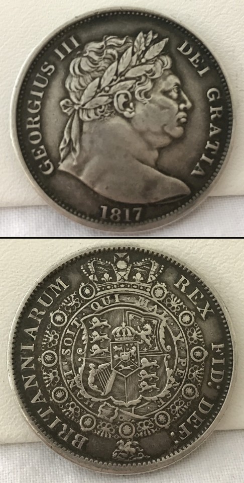 An 1817 George III 'Bull's head' silver half crown.