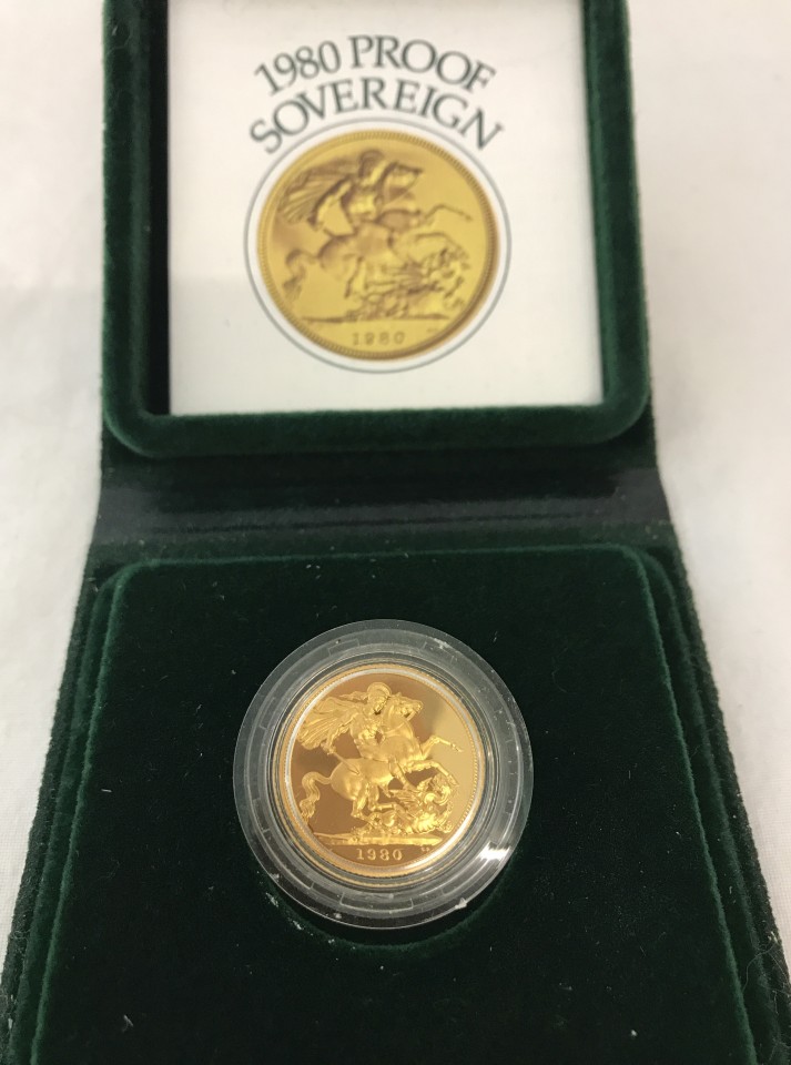 A cased 1980 Proof Sovereign gold coin with leaflet.