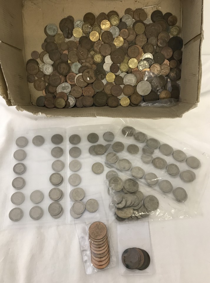 A box of assorted British coins.