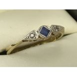 An 18ct gold and platinum Art Decco sapphire and diamond 3 stone dress ring.