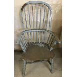 An antique painted elm spindle back Windsor chair.