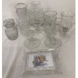 A small collection of cut crystal clear glassware.