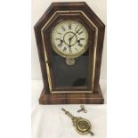 A One day Spring strike "Celtic" Waterbury Clock Co wooden cased mantle clock.